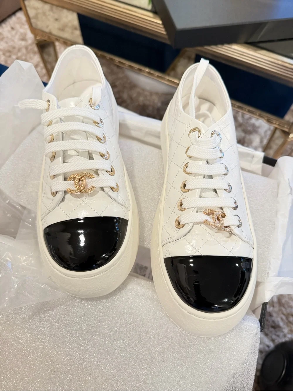 CHANEL White Quilted Sneakers with Black Patent Cap Toe and Gold CC Accent